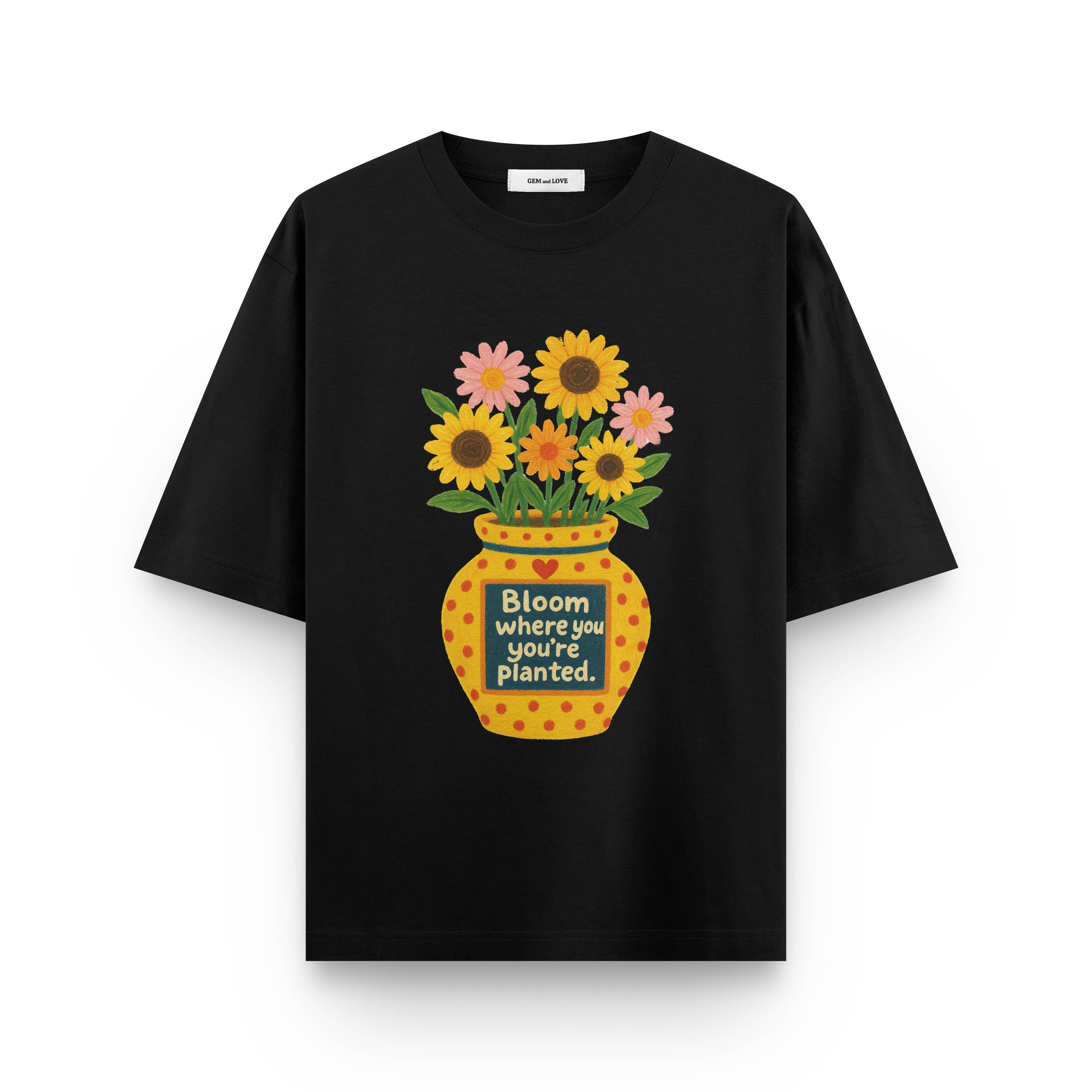 Black t-shirt with a colorful flower vase graphic and text on a white background