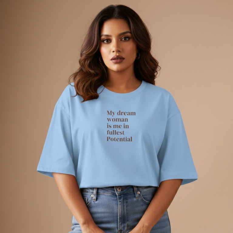 Woman wearing a light blue t-shirt with text on a beige background