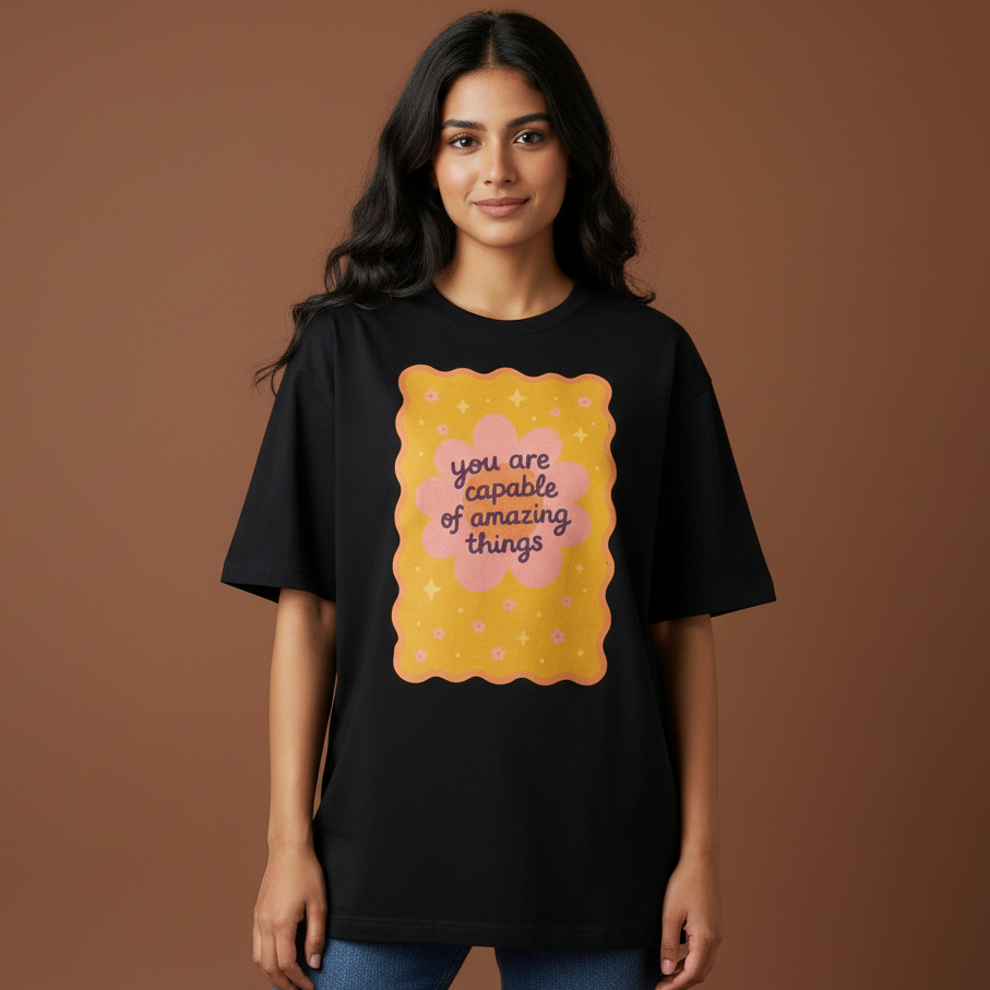 Woman wearing You are capable of amazing things oversized t-shirt