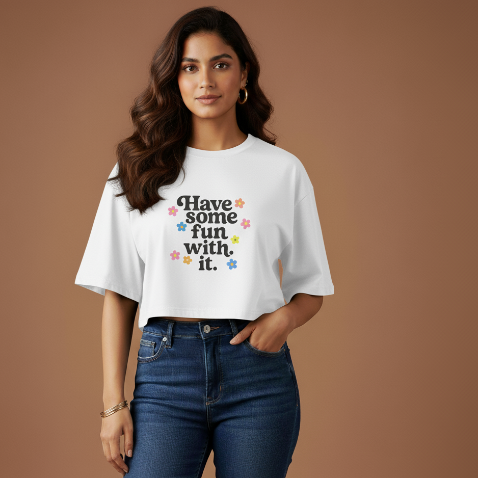 Woman wearing a white t-shirt with text and jeans on a brown background